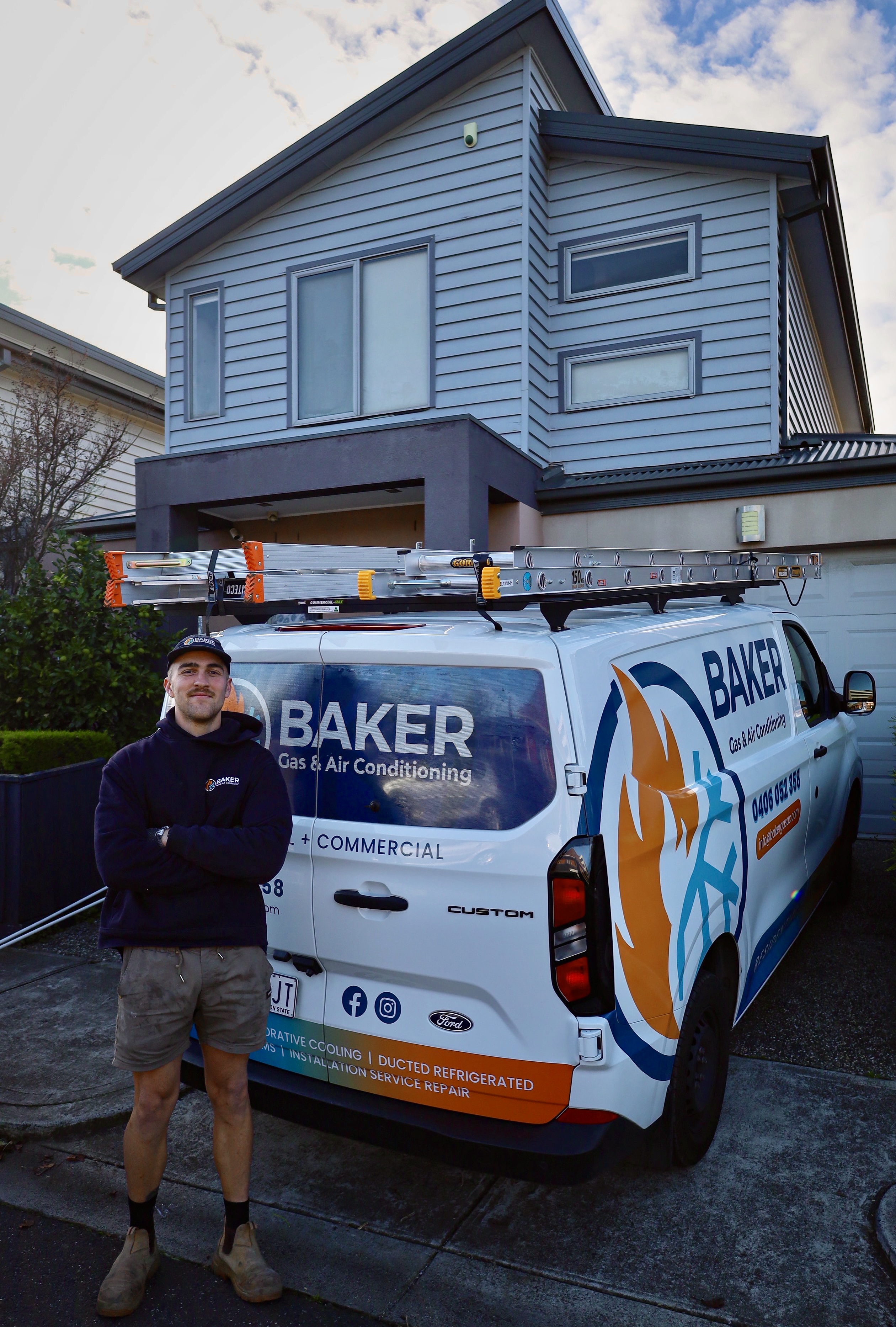 Baker Gas & Air Conditioning — tradesperson with fully branded service van at a Melbourne job site